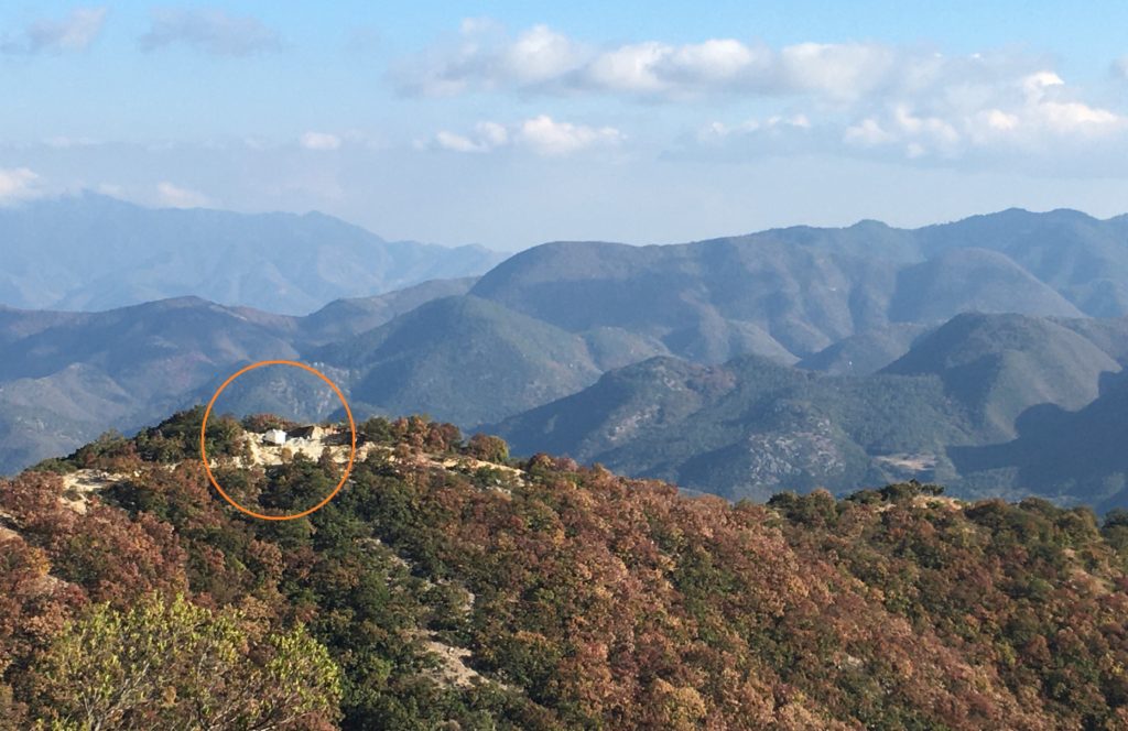 A view of the van and the parking spot, from further up the mountain road