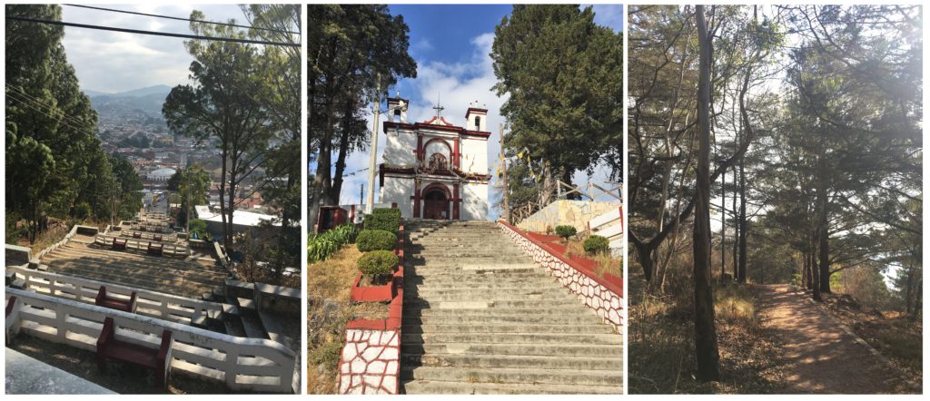 stairs up to red and white church