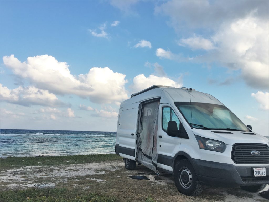 ford transit van vanlife open door beach background